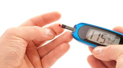 Diabetic patient doing glucose level blood test