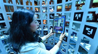 Augmented reality tablets immerse visitors to Intel's 2018 CES booth in an artificial intelligence-powered journey that represents the vast mountains of data housed and scanned by AI in the cloud. Intel Corporation displays how the power of data is affecting our daily lives at the 2018 Consumer Electronics Show (CES) from Jan. 8-12 in Las Vegas. (Credit: Walden Kirsch/Intel Corporation)